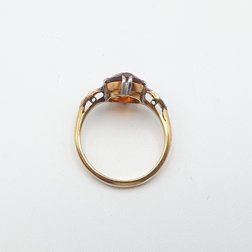 257 - A Fire Opal and Diamond Ring claw-set oval-cut fire opal between two millegrain-set eight-cut diamon... 