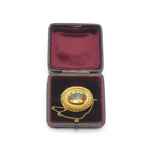 262 - A Victorian Citrine Brooch set oval mixed-cut stone in unmarked yellow metal, approx 29mm wide, appr... 
