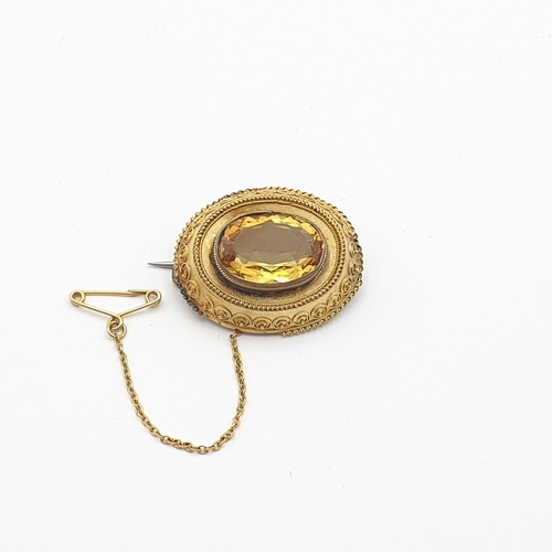 262 - A Victorian Citrine Brooch set oval mixed-cut stone in unmarked yellow metal, approx 29mm wide, appr... 