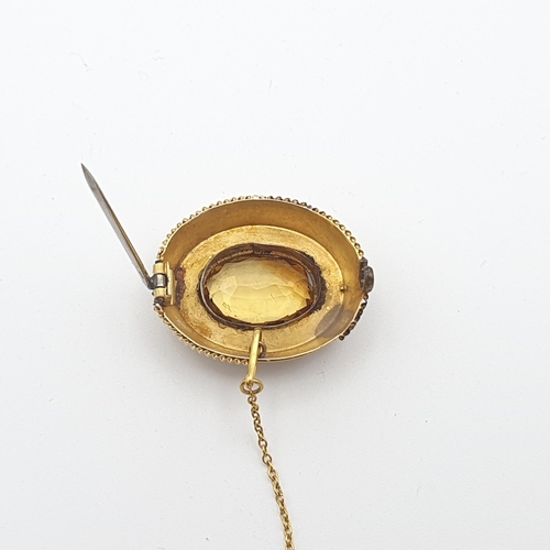 262 - A Victorian Citrine Brooch set oval mixed-cut stone in unmarked yellow metal, approx 29mm wide, appr... 