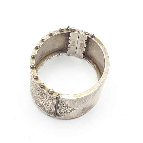 263 - A hinged Bangle with engraving to front marked Sterling silver, Coin Brooch, Agate Brooch, ceramic B... 