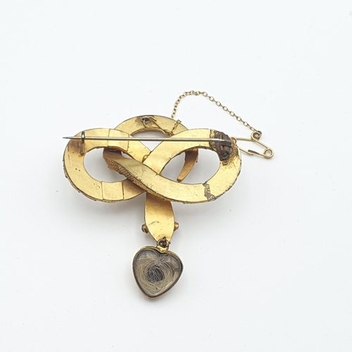 264 - A Victorian Target Brooch with blue enamel set split pearl to centre, woven hair enclosed verso and ... 