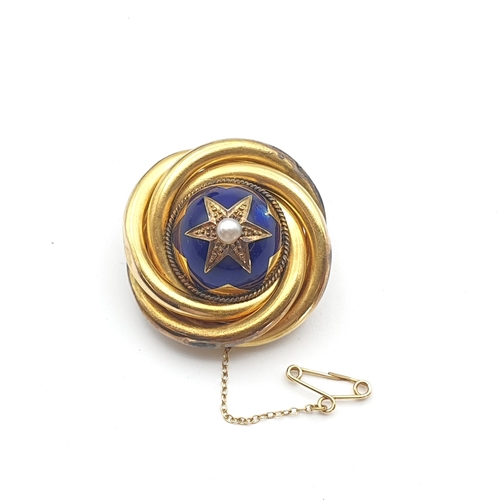264 - A Victorian Target Brooch with blue enamel set split pearl to centre, woven hair enclosed verso and ... 