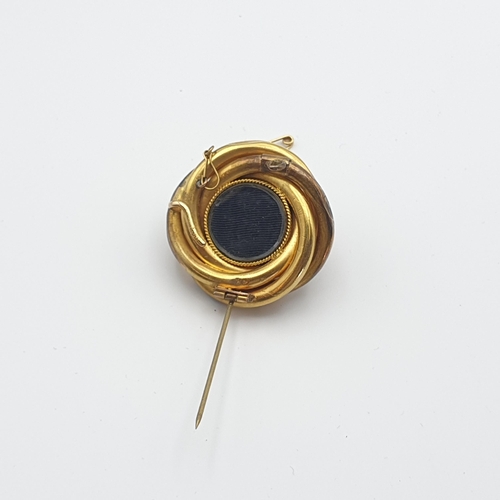 264 - A Victorian Target Brooch with blue enamel set split pearl to centre, woven hair enclosed verso and ... 
