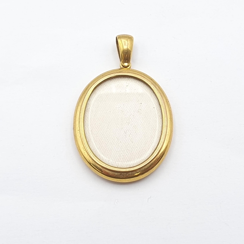 270 - A double-sided Locket stamped 9ct, 52mm long, glazed panels front and back, approx 12.1gms
