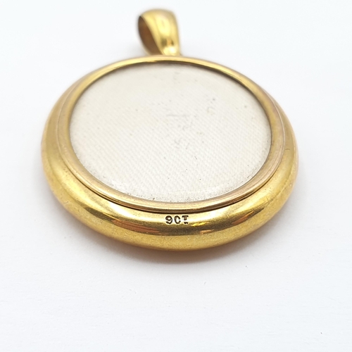 270 - A double-sided Locket stamped 9ct, 52mm long, glazed panels front and back, approx 12.1gms