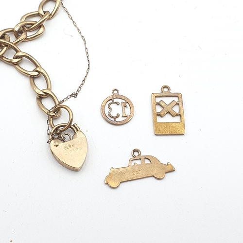 279 - A 9ct gold curb link Bracelet with padlock fastener and three charms, approx 6.8gms