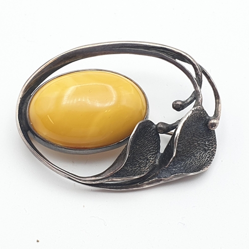 281 - A yellow Amber bead Necklace, approx 135gms, a long modern Amber chip Necklace and a white metal sty... 