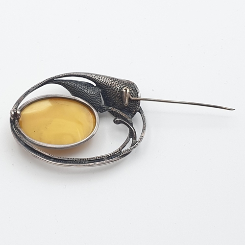 281 - A yellow Amber bead Necklace, approx 135gms, a long modern Amber chip Necklace and a white metal sty... 