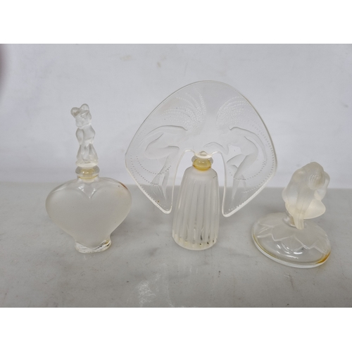 49 - Three modern Lalique glass Scent Bottles and Stoppers