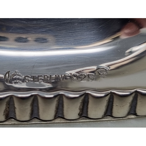 61 - A sterling silver two branch Candlestick on oblong base