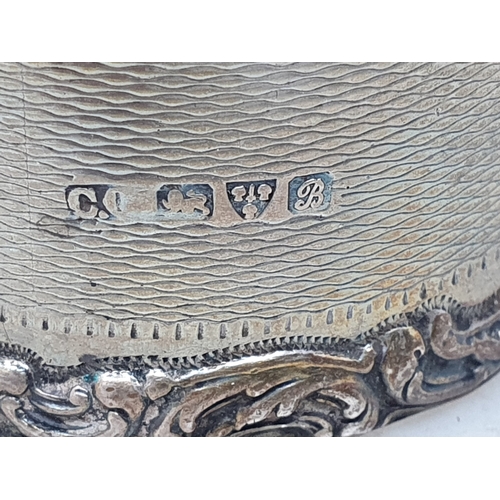 74 - An Edward VII silver Napkin Ring scroll engraved, Chester 1908,another, Chester 1902,and another, Bi... 