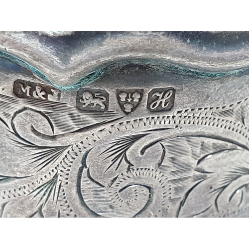 74 - An Edward VII silver Napkin Ring scroll engraved, Chester 1908,another, Chester 1902,and another, Bi... 