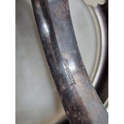 76 - Four various silver Bangles, two with leafage engraving, 95gms