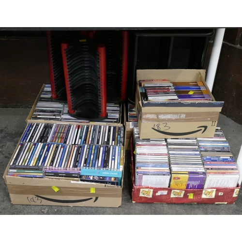 183 - Five boxes of CD's and a quantity of CD racks