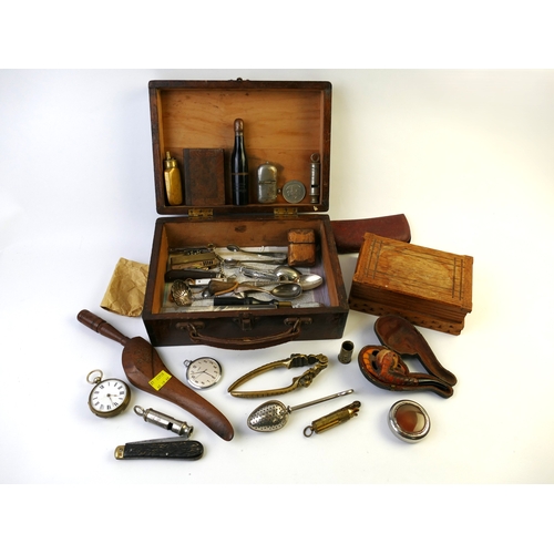 517 - Small wooden suitcase containing vintage pipes, pocket watches, nutcrackers, penknives, whistles, li... 