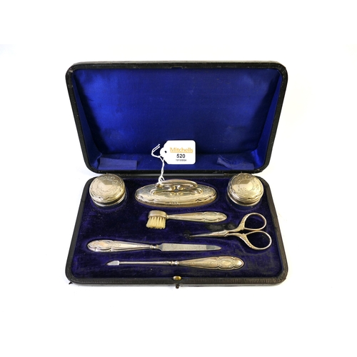 520 - Cased vanity grooming set with silver handles and lids