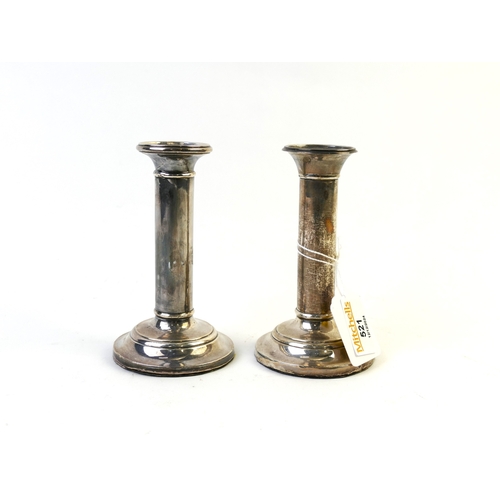 521 - Pair of silver candlesticks, 13 cm high