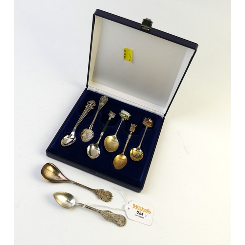 524 - Collection of silver and plated spoons, some with ornate filigree handles