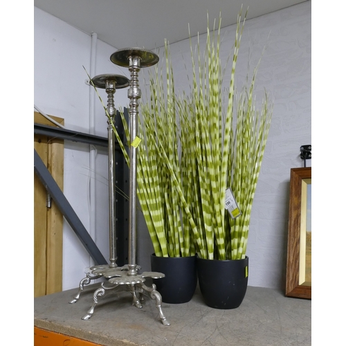 196 - Two artificial tall grass ornaments and pair of candle stands, height 65 cm