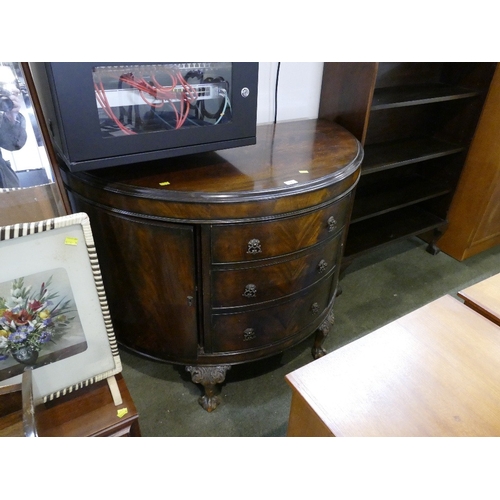 538 - Reproduction mahogany demi-lune cupboard with three central drawers