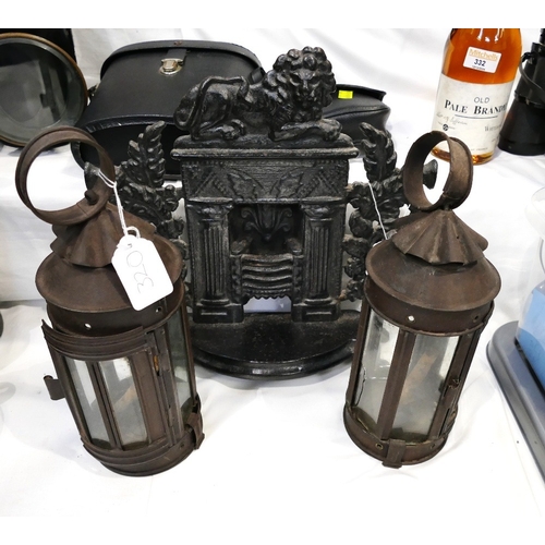 320 - Black metal small scale fire grate and pair of candle lanterns