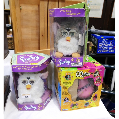 328 - Two vintage boxed Furbies and boxed Ooglies toy