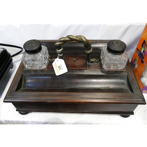 329 - Antique brass handled rosewood desk stand with twisted brass handles, two fitted inkwells and drawer... 