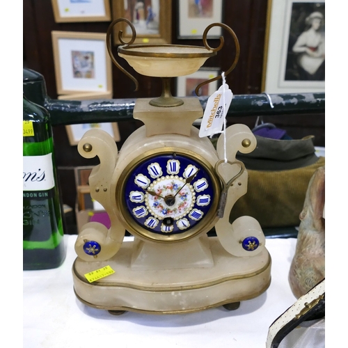 363 - An ornate French alabaster mantle clock with blue enamel floral face