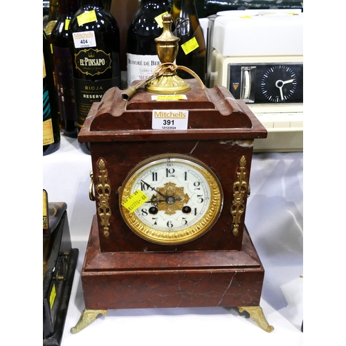 391 - Ornate red marble mantle clock with brass decoration and key