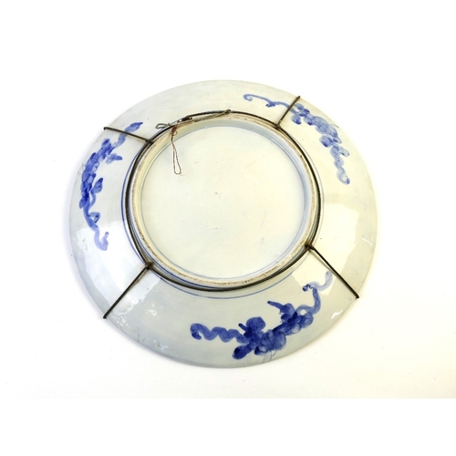 528 - Large blue and white oriental platter 41 cm diameter, featuring wise gentleman beneath a blossom tre... 