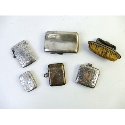 538 - Four hallmarked Vesta cases +/- 95 grams, silver topped nail brush and silver coated cigarette case