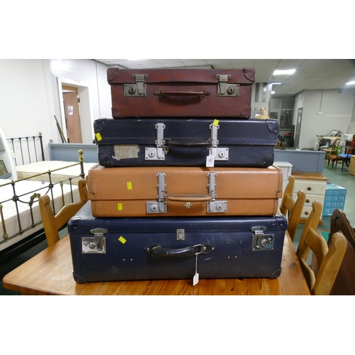 12 - Four vintage suitcases