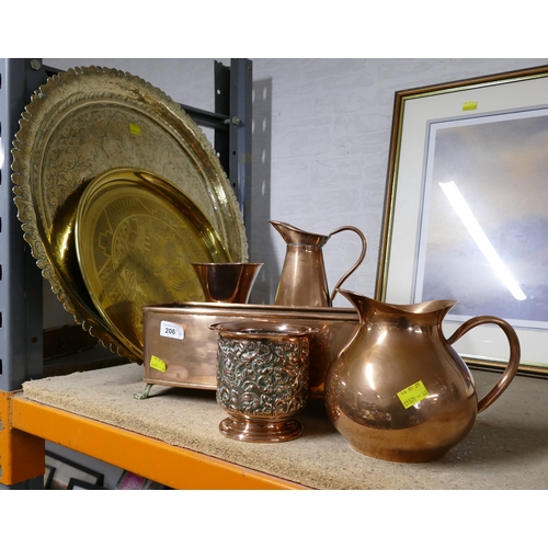 206 - Two large brass plaques of Middle Eastern design, largest +/- 60 cm diameter, and five copper items