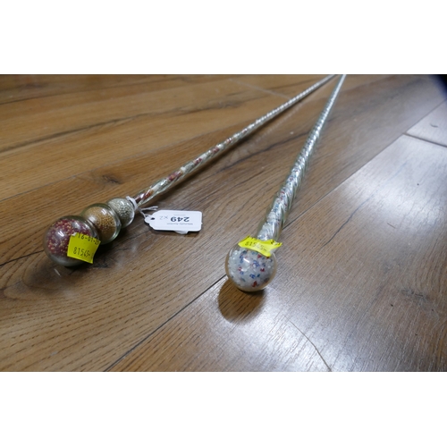 249 - Two twisted glass walking sticks with bead decoration