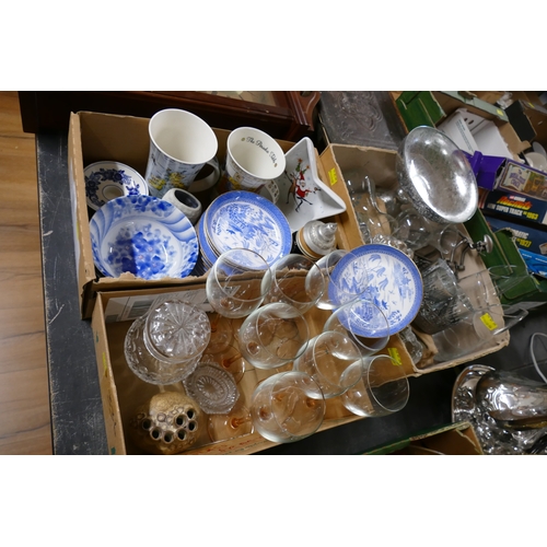 336 - Three boxes of glassware, wine glasses with pink stems, blue and white ceramics, mugs etc