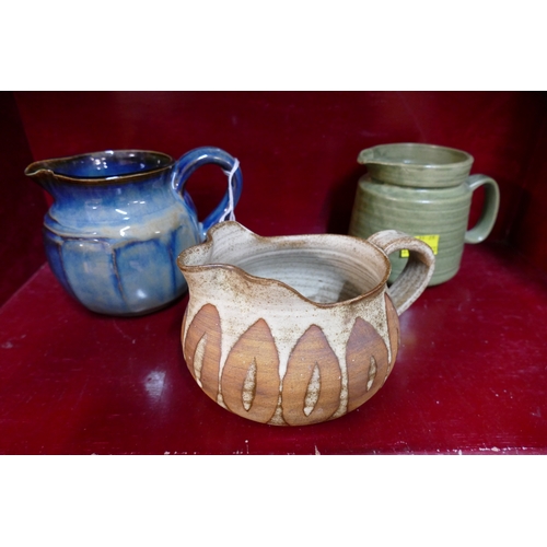 47 - Three Studio Pottery jugs, one marked JA Pottery