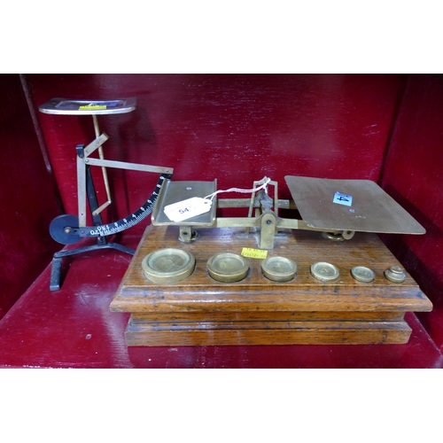 54 - Set of brass postal scales on heavy wooden plinth with weights and 9 oz balance scale