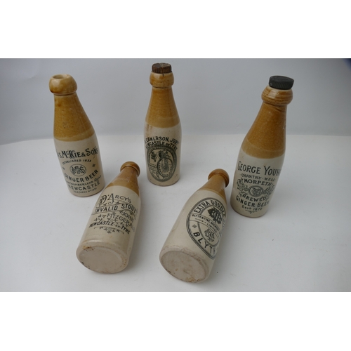 56 - Five stoneware brewery bottles, Darcy's Invalid Stout, George Young Ginger Beer of Morpeth, R. Emmer... 