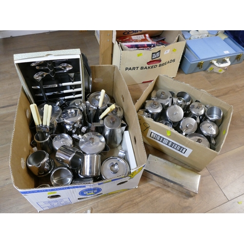 69 - Two boxes of stainless steel tea and coffee ware, cutlery etc