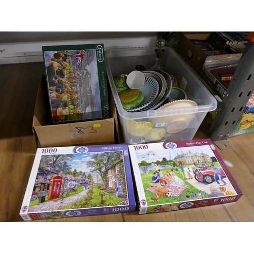 83 - Two boxes of ceramics, ornaments and jigsaw puzzles