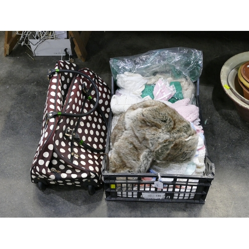 218 - Knitted baby clothes, linens, tablecloths, faux fur hat, luggage, etc