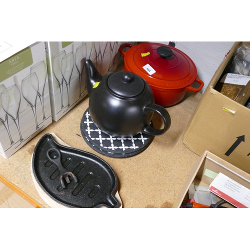 104 - Chasseur red metal lidded casserole dish, leaf shaped skillet, black ceramic teapot and quantity of ... 