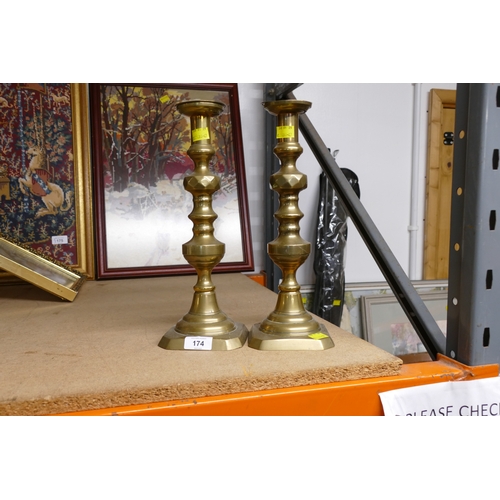 174 - Pair of brass candlesticks 34 cm high