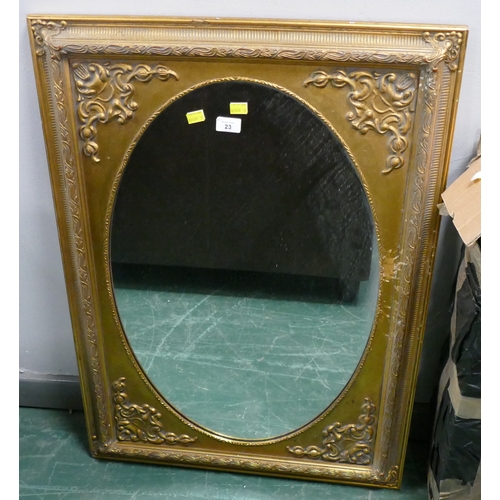 23 - Mirror in ornate gold coloured frame, 90 x 66 cm