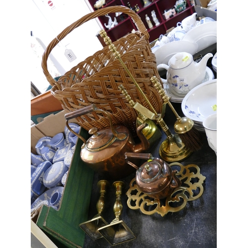 241 - Wicker basket with brass candlesticks, fireside accessories, trivet and two antique copper kettles