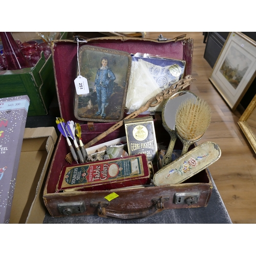 251 - Suitcase of vintage items, dressing table set, table cutlery, darts, tins, trinkets etc