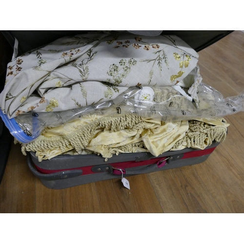 262 - Suitcase of curtains