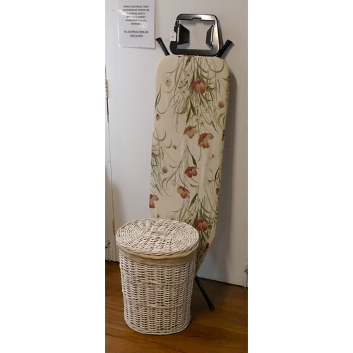 30 - Ironing board and white wicker laundry hamper