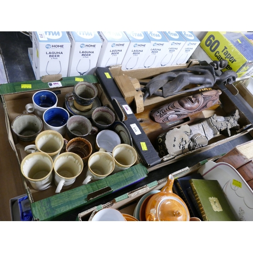 312 - Two boxes of studio pottery cups, saucers and wooden tribal carvings